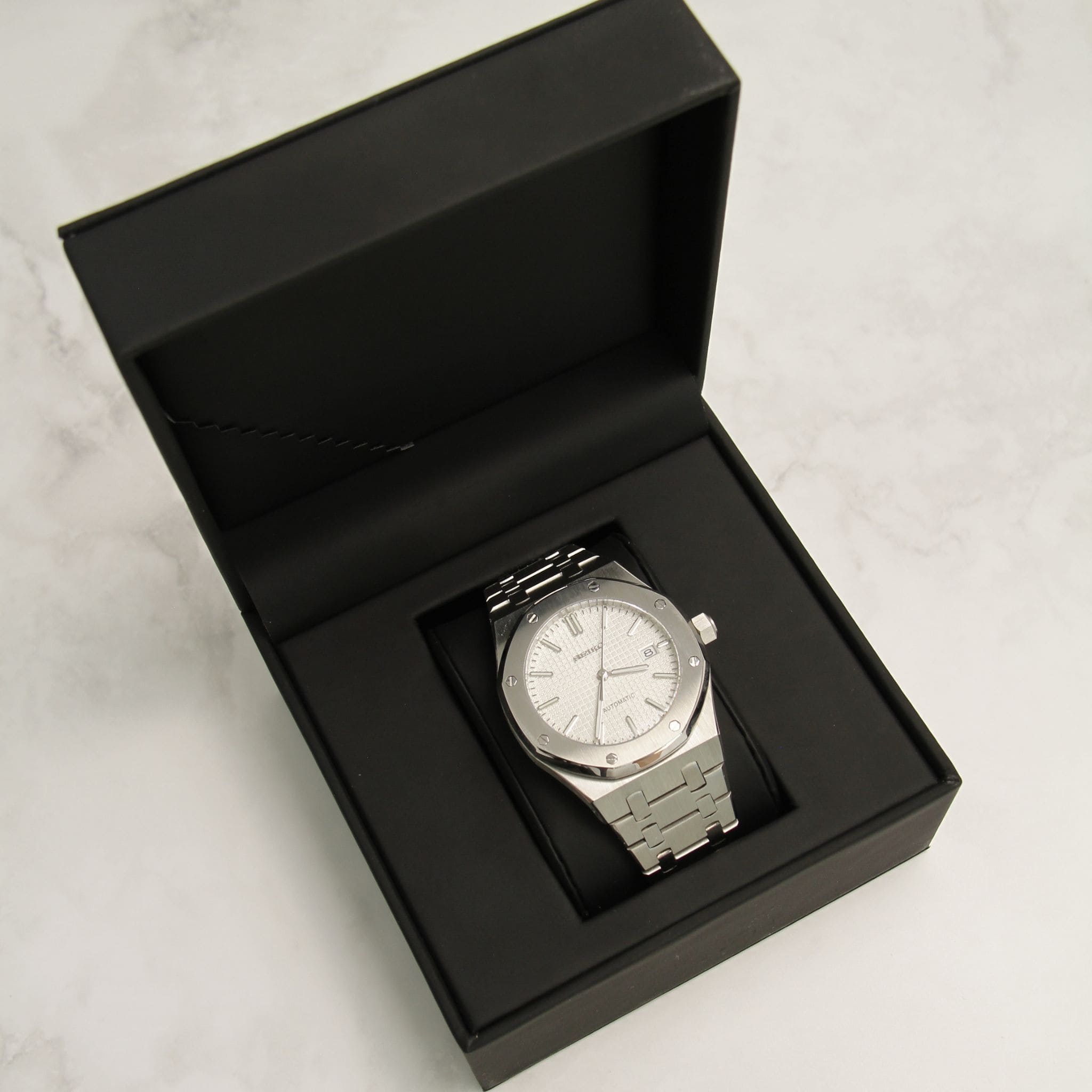 Montre Seiko mod Royal oak blanc dans son écrin Modus Seiko