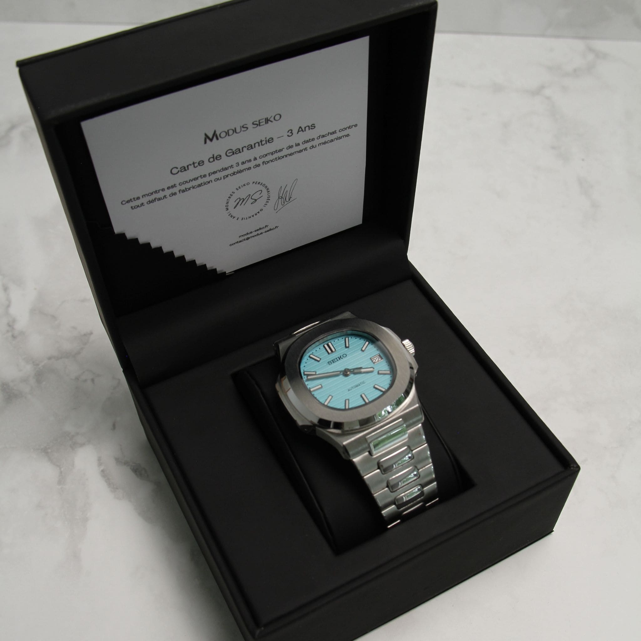 Montre Seiko mod nautilus Tiffany bleu ciel dans son écrin Modus Seiko